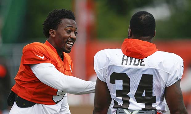 Cleveland Browns quarterback Tyrod Taylor, left, talks with running back Carlos Hyde (34) during NF...