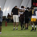 Arizona State quarterback Manny Wilkins looks on as defensive back Tyler Whiley is helped off the field by trainers during the team’s first srimmage of the season Saturday, Aug. 11, in Tempe. (Tyler Drake/Arizona Sports)