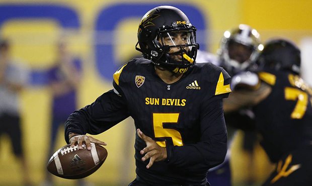 Arizona State quarterback Manny Wilkins (5) looks to pass the ball against Washington during the fi...