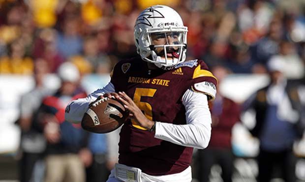 Arizona State quarterback Manny Wilkins throwing against North Carolina State during the first half...