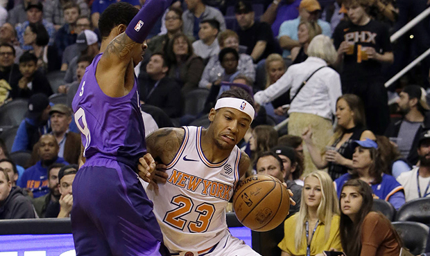 New York Knicks guard Trey Burke (23) drives as Phoenix Suns guard Tyler Ulis defends during the fi...