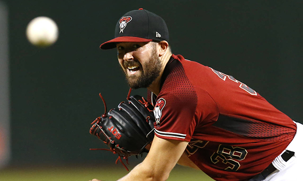 Arizona Diamondbacks pitcher Robbie Ray throws in the first inning of a baseball game against the S...