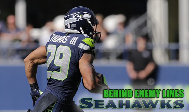 Seattle Seahawks free safety Earl Thomas runs with the ball after intercepting a pass intended for ...