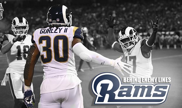 Los Angeles Rams running back Todd Gurley is greeted by teammates Cooper Kupp (18) and Robert Woods...
