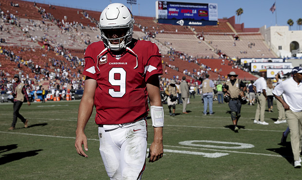 Arizona Cardinals quarterback Sam Bradford leaves the field after their loss against the Los Angele...