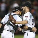 Arizona Diamondbacks closer Brad Boxberger (31) is congratulated by catcher Jeff Mathis after pitching the ninth inning in a 5-3 victory against the Atlanta Braves during a baseball game, Friday, Sept. 7, 2018, in Phoenix. (AP Photo/Ralph Freso)