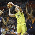 Seattle Storm forward Breanna Stewart (30) shoots between the defense of Phoenix Mercury center Brittney Griner (42) and Camile Little (20) during the second half of Game 4 of a WNBA basketball semifinals playoff game, Sunday, Sept. 2, 2018, in Phoenix. (AP Photo/Ralph Freso)