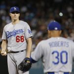 Los Angeles Dodgers pitcher Ross Stripling (68) holds the baseball as manager Dave Roberts (30) walks out to remove Stripling during the second inning of a baseball game against the Arizona Diamondbacks on Wednesday, Sept. 26, 2018, in Phoenix. (AP Photo/Ross D. Franklin)