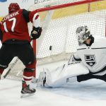 Los Angeles Kings goalie Peter Budaj (31) makes a pad save on a shot by Arizona Coyotes center Alex Galchenyuk (17) during the second period of an NHL preseason hockey game Tuesday, Sept. 18, 2018, in Glendale, Ariz. (AP Photo/Ross D. Franklin)