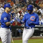 Chicago Cubs' Albert Almora Jr., right, celebrates his run scored against the Arizona Diamondbacks with Javier Baez, left, during the sixth inning of a baseball game Monday, Sept. 17, 2018, in Phoenix. (AP Photo/Ross D. Franklin)