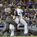 Los Angeles Dodgers' new acquisition David Freese is tagged out by Arizona Diamondbacks catcher Jeff Mathis during a rundown after Freese was caught off third base on a grounder by Austin Barnes in the fourth inning of a baseball game, Saturday, Sept. 1, 2018, in Los Angeles. (AP Photo/Michael Owen Baker)