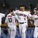 Arizona Diamondbacks' Ketel Marte (4), Nick Ahmed (13), David Peralta (6) and A.J. Pollock, right, celebrate the team's 5-1 win against the Los Angeles Angels in a baseball game Wednesday, Aug. 22, 2018, in Phoenix. (AP Photo/Ross D. Franklin)