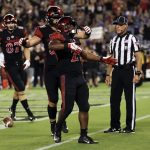 San Diego State running back Juwan Washington, center, reacts with teammates after scoring a touchdown during the first half of an NCAA college football game against Arizona State, Saturday, Sept. 15, 2018, in San Diego. (AP Photo/Gregory Bull)