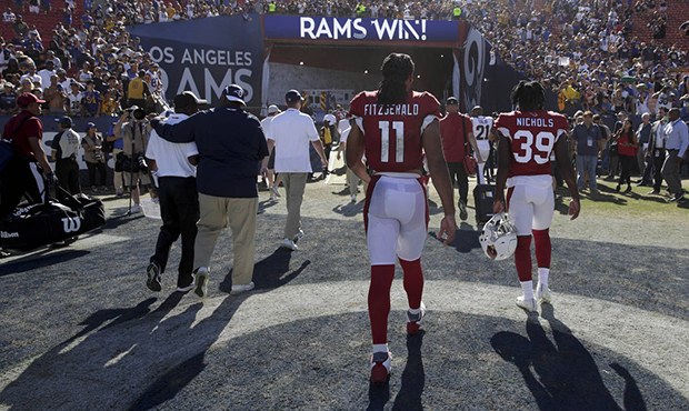 Arizona Cardinals wide receiver Larry Fitzgerald (11) leaves the field after their 34-0 loss agains...