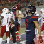 Arizona wide receiver Tony Ellison (9) reacts after scoring a touchdown in the first half during an NCAA college football game against Southern Utah, Saturday, Sept. 15, 2018, in Tucson, Ariz. (AP Photo/Rick Scuteri)