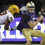 Washington quarterback Jake Browning, right, is sacked by Arizona State linebacker Malik Lawal (39) during the first half of an NCAA college football game Saturday, Sept. 22, 2018, in Seattle. (AP Photo/Ted S. Warren)