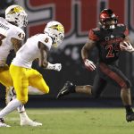 San Diego State running back Juwan Washington, right, runs with the ball as Arizona State safety Jalen Harvey (43), and defensive back Kobe Williams (5) defend during the second half of an NCAA college football game Saturday, Sept. 15, 2018, in San Diego. (AP Photo/Gregory Bull)