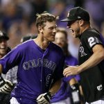 Colorado Rockies' DJ LeMahieu, left, is congratulated by pitcher Kyle Freeland after LeMahieu hit a two-run home run off Arizona Diamondbacks relief pitcher Yoshihisa Hirano in the ninth inning of a baseball game Wednesday, Sept. 12, 2018, in Denver. The Rockies won 5-4.(AP Photo/David Zalubowski)