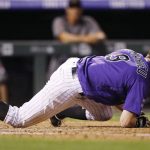 Colorado Rockies' DJ LeMahieu drops to the dirt to avoid an inside pitch from Arizona Diamondbacks relief pitcher Jimmie Sherfy in the seventh inning of a baseball game Monday, Sept. 10, 2018, in Denver. (AP Photo/David Zalubowski)