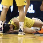 Seattle Storm guard Sue Bird lays on the court after taking an elbow to the face during the first half of Game 4 of a WNBA basketball semifinals playoff game against the Phoenix Mercury, Sunday, Sept. 2, 2018, in Phoenix. Bird would leave the game and not return. (AP Photo/Ralph Freso)