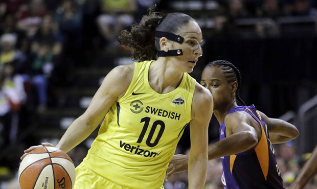Seattle Storm's Sue Bird (10) drives past Phoenix Mercury's Yvonne Turner during the first half of ...