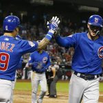 Chicago Cubs' Kris Bryant, right, celebrates his home run against the Arizona Diamondbacks with Javier Baez (9) during the eighth inning of a baseball game, Monday, Sept. 17, 2018, in Phoenix. The Cubs defeated the Diamondbacks 5-1. (AP Photo/Ross D. Franklin)