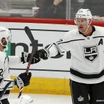 Los Angeles Kings center Jeff Carter, right, celebrates his goal against the Arizona Coyotes with Michael Amadio (52) during the third period of an NHL preseason hockey game Tuesday, Sept. 18, 2018, in Glendale, Ariz. The Coyotes defeated the Kings 4-2. (AP Photo/Ross D. Franklin)