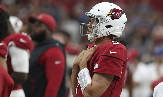 Arizona Cardinals quarterback Sam Bradford watches the closing moments of an NFL football game from...