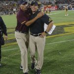 Arizona State head coach Herm Edwards, left, celebrates a win against Michigan State with defensive coordinator Danny Gonzales, right, after an NCAA college football game Saturday, Sept. 8, 2018, in Tempe, Ariz. Arizona State defeated Michigan State 16-13. (AP Photo/Ross D. Franklin)