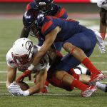 Southern Utah linebacker Taylor Nelson (94) recovers a fumble in front of Arizona wide receiver Shawn Poindexter in the first half during an NCAA college football game, Saturday, Sept. 15, 2018, in Tucson, Ariz. (AP Photo/Rick Scuteri)