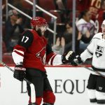 Arizona Coyotes center Alex Galchenyuk (17) celebrates his goal as Los Angeles Kings right wing Tyler Toffoli (73) skates past during the first period of an NHL preseason hockey game Tuesday, Sept. 18, 2018, in Glendale, Ariz. (AP Photo/Ross D. Franklin)