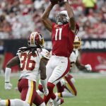 Arizona Cardinals wide receiver Larry Fitzgerald (11) pulls in a catch as Washington Redskins defensive back D.J. Swearinger (36) defends during the second half of an NFL football game, Sunday, Sept. 9, 2018, in Glendale, Ariz. (AP Photo/Rick Scuteri)