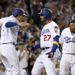 
              Los Angeles Dodgers' Matt Kemp, center, is greeted at home plate by Manny Machado, left, and Justin Turner after hitting a three-run homer in the eighth inning of a baseball game against the Arizona Diamondbacks, Saturday, Sept. 1, 2018, in Los Angeles. (AP Photo/Michael Owen Baker)
            