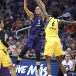 Phoenix Mercury forward Diana Taurasi (3) passes the ball over the defense of Seattle Storm's Natasha Howard (6) during the first half of Game 4 of a WNBA basketball playoffs semifinal Sunday, Sept. 2, 2018, in Phoenix. (AP Photo/Ralph Freso)