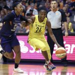 Seattle Storm guard Jewell Loyd (24) drives to the basket past the defense of Phoenix Mercury guard Briann January during the second half of Game 4 of a WNBA basketball semifinals playoff game, Sunday, Sept. 2, 2018, in Phoenix. (AP Photo/Ralph Freso)
