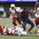 Southern Utah safety AJ Stanley (33) causes a fumble from Arizona quarterback Khalil Tate (14) in the first half during an NCAA college football game, Saturday, Sept. 15, 2018, in Tucson, Ariz. (AP Photo/Rick Scuteri)