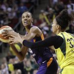 Phoenix Mercury's DeWanna Bonner, left, is defended by Seattle Storm's Alysha Clark (32) during the first half of Game 5 of a WNBA basketball playoffs semifinal, Tuesday, Sept. 4, 2018, in Seattle. (AP Photo/Elaine Thompson)