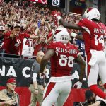 Arizona Cardinals tight end Ricky Seals-Jones (86) celebrates his touchdown against the Chicago Bears with J.J. Nelson (14) and fans during the first half of an NFL football game, Sunday, Sept. 23, 2018, in Glendale, Ariz. (AP Photo/Ralph Freso)