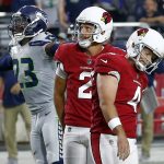 Arizona Cardinals kicker Phil Dawson (4) walks away after missing a field goal as Seattle Seahawks defensive back Neiko Thorpe (23) and Arizona Cardinals punter Andy Lee (2) watch during the second half of an NFL football game, Sunday, Sept. 30, 2018, in Glendale, Ariz. The Seahawks won 20-17. (AP Photo/Ross D. Franklin)
