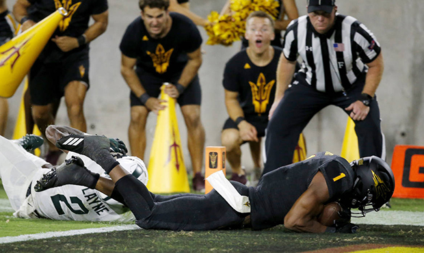 Arizona State wide receiver N'Keal Harry (1) dives into the end zone for a touchdown as he gets pas...