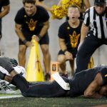 Arizona State wide receiver N'Keal Harry (1) dives into the end zone for a touchdown as he gets past Michigan State cornerback Justin Layne (2) during the second half of an NCAA college football game Saturday, Sept. 8, 2018, in Tempe, Ariz. Arizona State defeated Michigan State 16-13. (AP Photo/Ross D. Franklin)