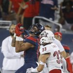 Arizona wide receiver Shawn Poindexter catches a touchdown over the top of Southern Utah safety AJ Stanley (33) in the second half during an NCAA college football game, Saturday, Sept. 15, 2018, in Tucson, Ariz. (AP Photo/Rick Scuteri)