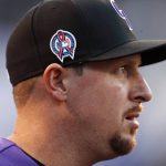 Colorado Rockies relief pitcher Bryan Shaw wears a special patch on his cap to mark the anniversary of the 9/11 terrorist attacks before a baseball game against the Arizona Diamondbacks, Tuesday, Sept. 11, 2018, in Denver. (AP Photo/David Zalubowski)