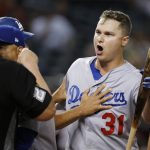 Los Angeles Dodgers' Joc Pederson (31) argues with umpire Joe West, left, after Pederson was thrown out during the ninth inning of a baseball game against the Arizona Diamondbacks, Monday, Sept. 24, 2018, in Phoenix. The Dodgers defeated the Diamondbacks 7-4. (AP Photo/Ross D. Franklin)