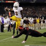 Arizona State wide receiver Brandon Aiyuk (2) goes over San Diego State safety Parker Baldwin (33) to score a touchdown during the first half of an NCAA college football game, Saturday, Sept. 15, 2018, in San Diego. (AP Photo/Gregory Bull)