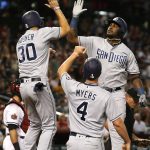 San Diego Padres Franmil Reyes gets a high fives from Eric Hosmer (30) and Wil Myers (4) after hitting a three-run home run against the Arizona Diamondbacks in the second inning during a baseball game, Monday, Sept. 3, 2018, in Phoenix. (AP Photo/Rick Scuteri)