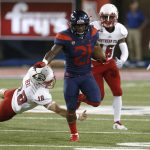 Arizona running back J.J. Taylor (21) breaks the tackle from Southern Utah place kicker Manny Berz (18) and scores a touchdown on a kickoff in the first half during an NCAA college football game, Saturday, Sept. 15, 2018, in Tucson, Ariz. (AP Photo/Rick Scuteri)
