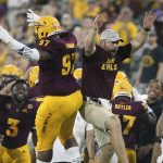 Arizona State defensive lineman Shannon Forman (97) celebrates with a member of the coaching staff after returning an interception for a touchdown against UTSA during the first half of an NCAA college football game, Saturday, Sept. 1, 2018, in Tempe, Ariz. (AP Photo/Ralph Freso)