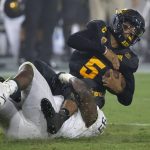 Arizona State quarterback Manny Wilkins (5) gets tackled by Michigan State defensive tackle Raequan Williams (99) during the first half of an NCAA college football game Saturday, Sept. 8, 2018, in Tempe, Ariz. (AP Photo/Ross D. Franklin)