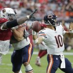 Chicago Bears quarterback Mitchell Trubisky (10) gets off a pass before Arizona Cardinals defensive tackle Robert Nkemdiche, left, arrives during the second half of an NFL football game, Sunday, Sept. 23, 2018, in Glendale, Ariz. (AP Photo/Rick Scuteri)